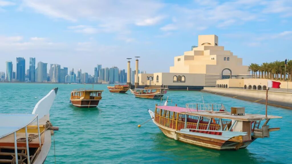 Traditional wooden boat sailing on a Sunset Dhow Cruise in Doha